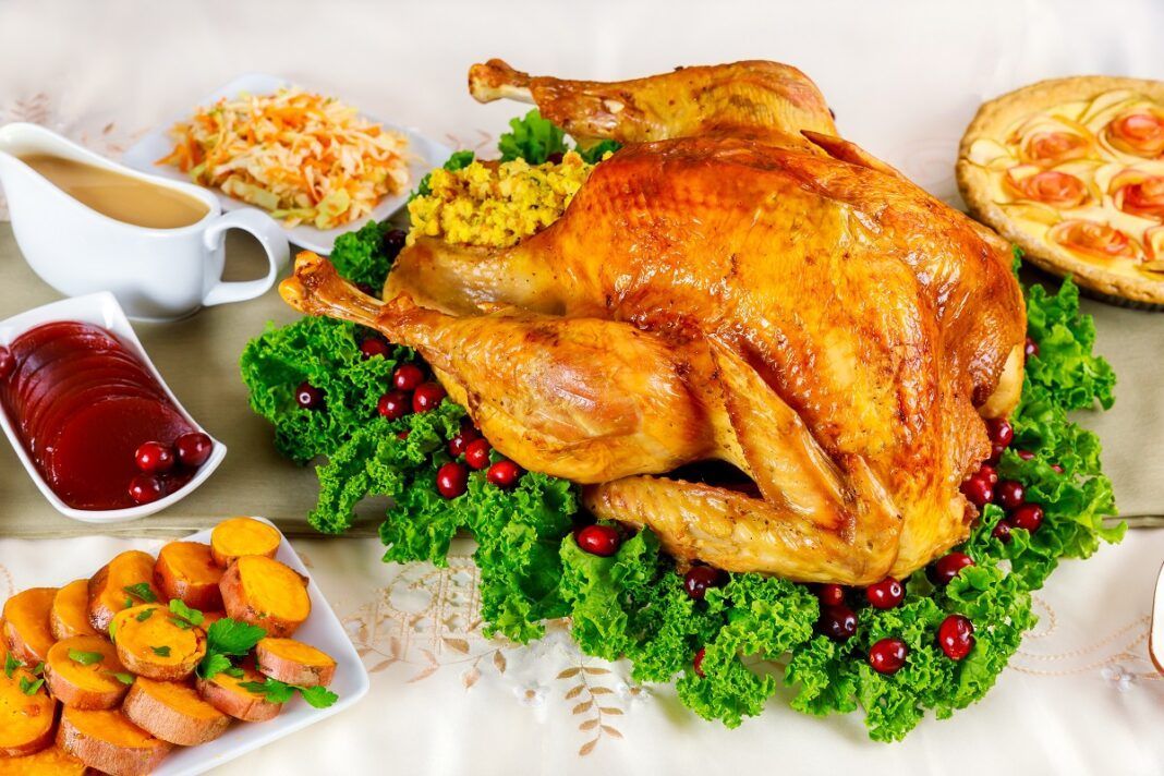 For Thanksgiving Day, there is nothing better than a turkey decorated with herbs and cranberries.