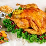For Thanksgiving Day, there is nothing better than a turkey decorated with herbs and cranberries.